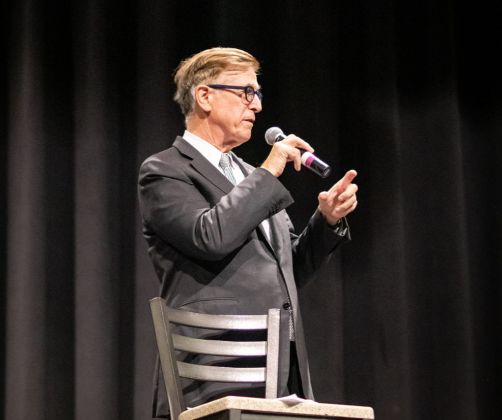 a man speaking on stage